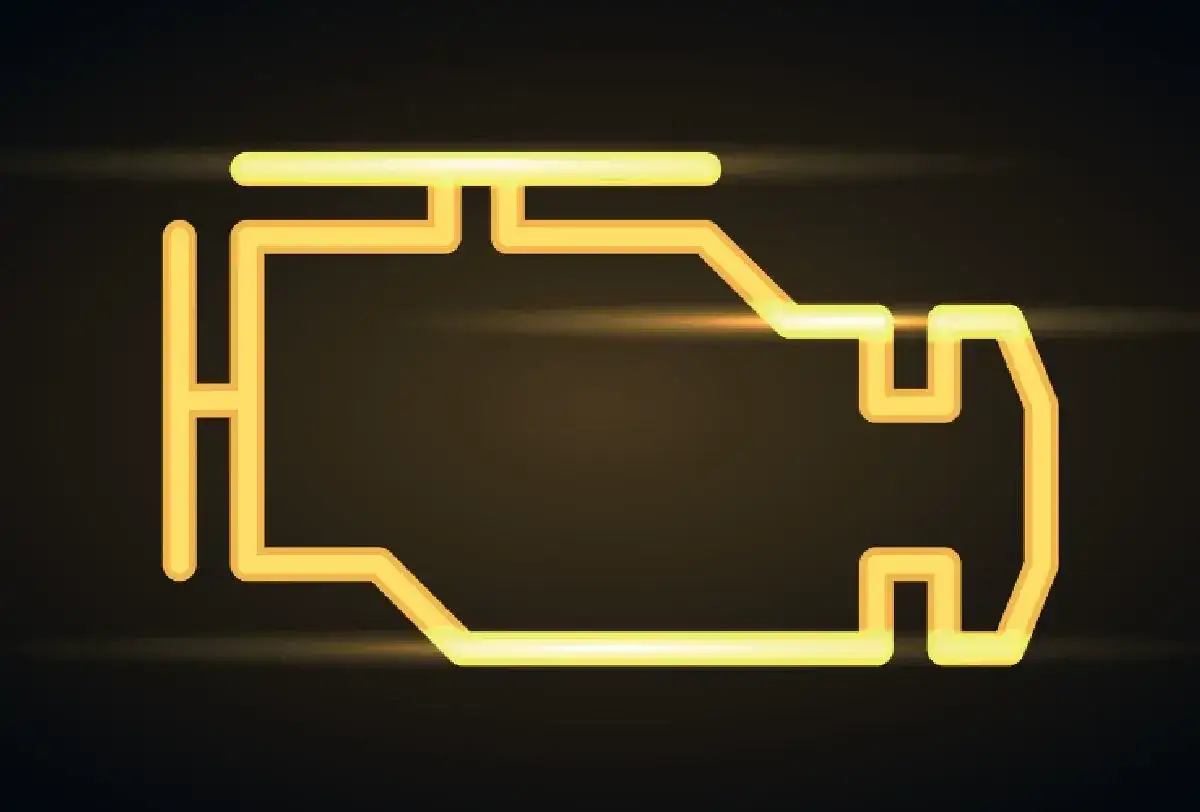 Icona stilizzata di un motore con la spia motore accesa, illuminata da una luce gialla su sfondo scuro.